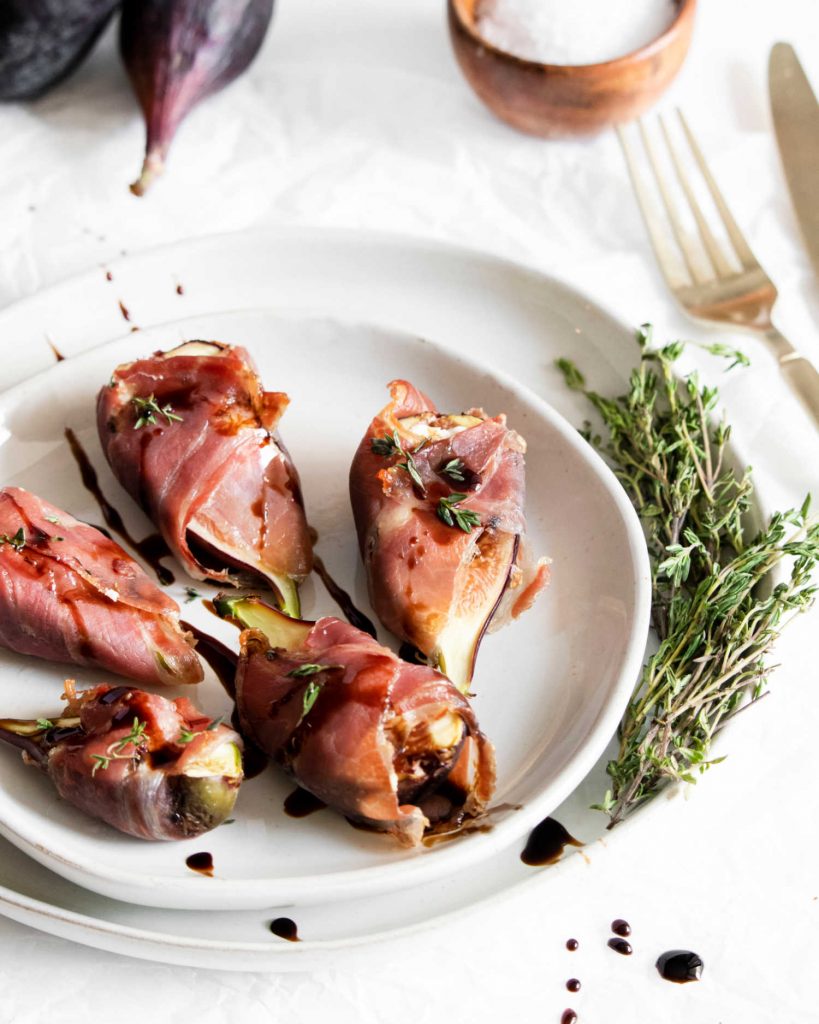 fig appetizers on a white plate