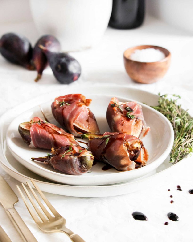 fig appetizers on a white plate