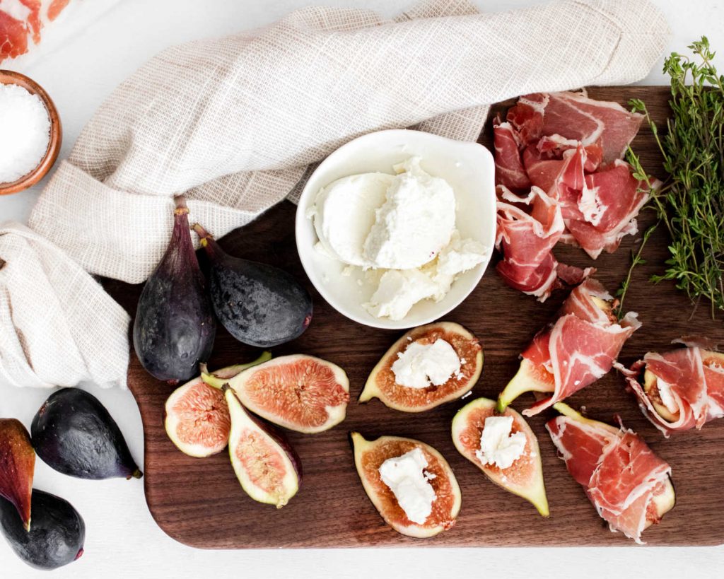 figs cut in half with goat cheese